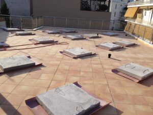 Photovoltaic (pv) solar panel roof of 10 kWatts anchored above counterweights at Athens