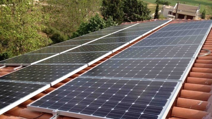 Photovoltaic solar panels on a tile roof with a rated power of  9.99 kWatts at Thebes