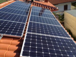 Photovoltaic (pv) solar panels on a tile roof with a rated power of 9.99 kWatts at Thebes