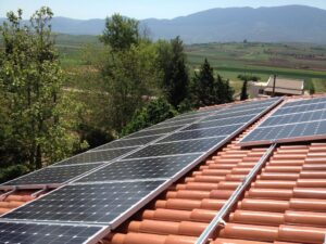 Photovoltaic (pv) solar panels on a tile roof with a rated power of 9.99 kWatts at Thebes