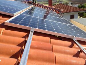 Photovoltaic (pv) solar panels on a tile roof with a rated power of 9.99 kWatts at Thebes