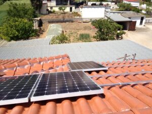 Photovoltaic (pv) solar panels on a tile roof with a rated power of 9.99 kWatts at Thebes
