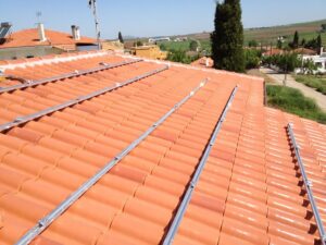 Photovoltaic (pv) solar panels on a tile roof with a rated power of 9.99 kWatts at Thebes