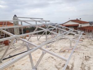 Photovoltaic solar panel roof with a rated power of 9.8 kWatts at Aigio
