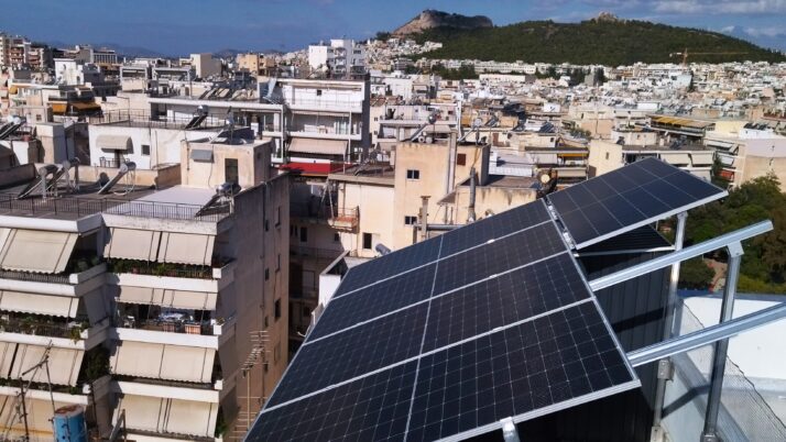 Small photovoltaic (pv) net metering (or net energy metering) system  with 2.7kW power of solar panels on a flat roof at Zografou/Goudi area, Athens (Attica)