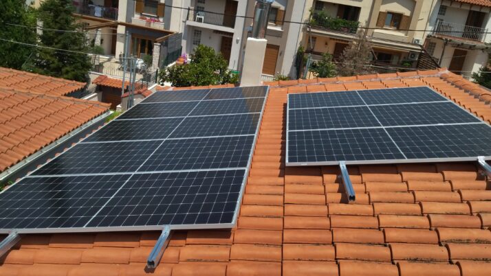 Photovoltaic (pv) net metering (or net energy metering) system of 8.64kW on a ceramic tiled roof at Anixi, Attica, Greece